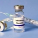 Frascos de vacuna contra la influenza y una jeringa